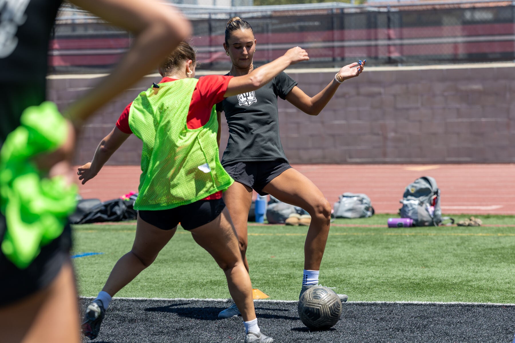 Women's athletes training with a coach