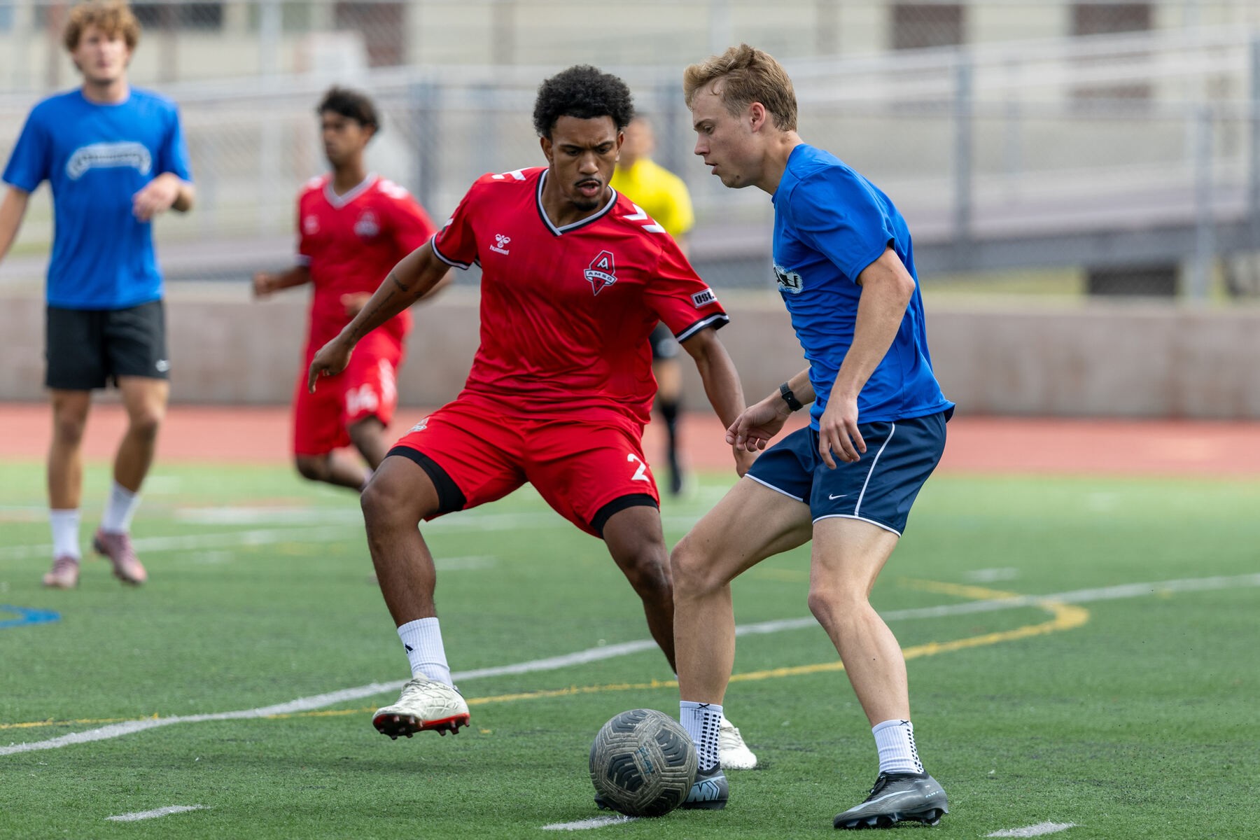 Men's athlete competing for the ball during a match